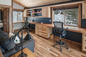 When work beckons, enjoy the custom office area.