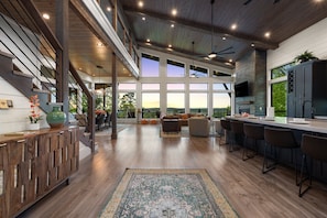 Imagine this entrance as you come through the front door and see the floor to ceiling windows with the gourmet kitchen and open family room.