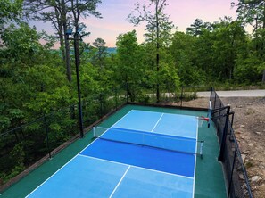 Combo lighted pickleball/basketball court tucked into the mountain side