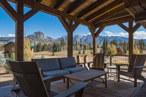 Deck with seating, wood burning fireplace and awesome views