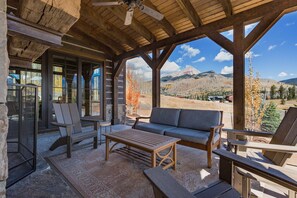Deck with seating, wood burning fireplace and awesome views