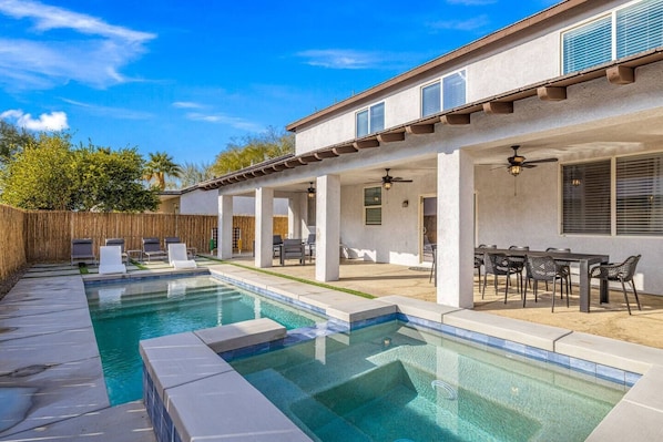 Pool Spa Sun Loungers, covered patio outdoor dining, and fire pit.   