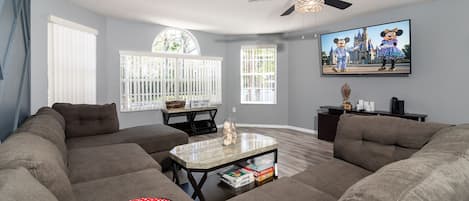 Cozy and spacious living area with TV