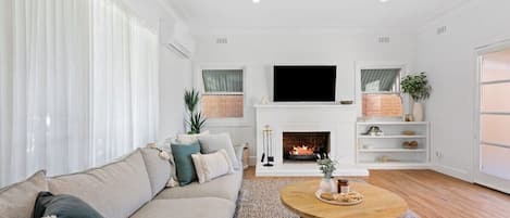 Inviting living room with oak coffee table and wool rug