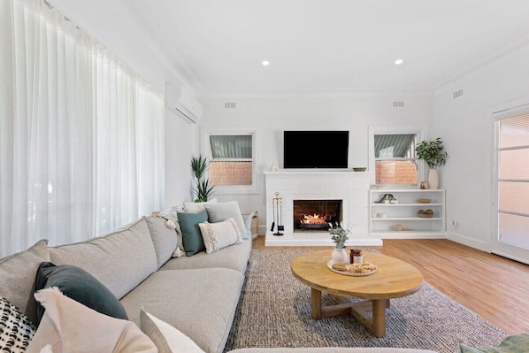 Inviting living room with oak coffee table and wool rug