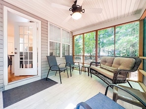 Screened in back porch to peacefully enjoy your morning coffee while taking in the backyard views