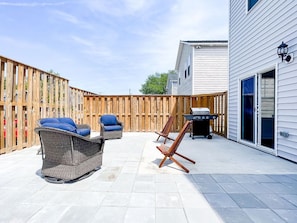 Fenced in yard and patio with BBQ