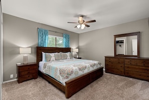 Enjoy a restful slumber in our serene bedroom, boasting a comfortable king bed and a calming atmosphere.
