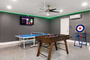 Get ready for endless fun and excitement in our action-packed game room, equipped with ping pong, foosball, and even axe throwing for a thrilling experience.