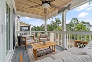 Start your day with coffee in hand as you settle into the cozy screened-in porch, where gentle breezes and scenic views set a peaceful tone. In the evening, unwind with a glass of wine and let the quiet beauty of the outdoors ease you into relaxation.