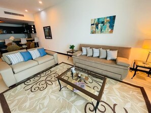 Living room with modern furniture and sleeper-sofa.