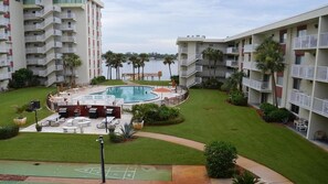 Beautiful pool with lots of outdoor space with grills to barbeque.