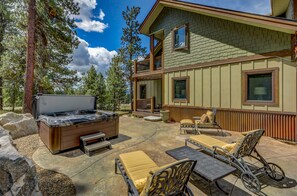 5-7 person hot tub with lounge chairs and chair