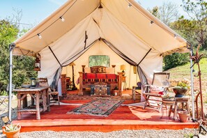 Unwind and recharge for another day of adventure as you enter the safari tent.