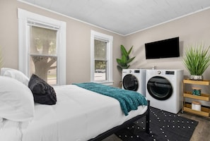 Second queen bedroom is on the main level with a 43" Roku TV and closet for storage. Washer and dryer are in this bedroom. Laundry detergent and a wool dryer ball are stocked! An iron and ironing board are also available in the bedroom closet.