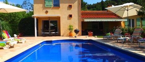 View of the house from the far end of the pool