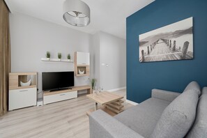 Another view of the living room, showcasing its spacious design and minimalist decor.
