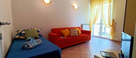 Cosy living room of the flat for rent in Viareggio.