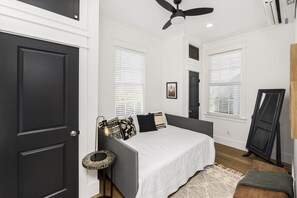 The bedroom has a full-size bed and ample closet space.