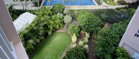 Balcony view of the tennis court and beach

