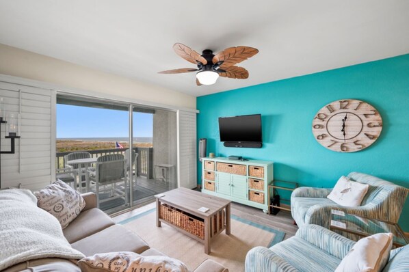 View of balcony and ocean from living room.