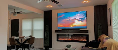 Luxury Retreat: Plush furnishings, 72" fireplace, and a stunning 75" QLED TV.