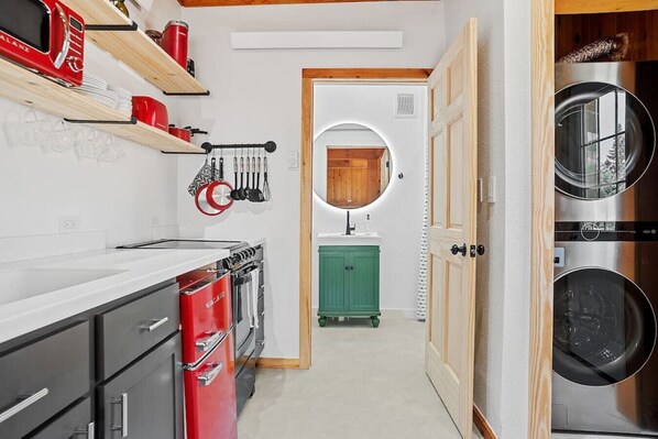 This unique place has a style all its own. Featuring LED makeup mirror with defogger, a fully stocked kitchen, and a full-size washer and dryer.