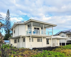 This is the Rear View of the Home that Looks Out Over the Ocean.