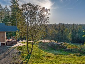 As you arrive, you'll immediately be captivated by the picturesque view of the meadow and seasonal pond, which creates a soothing ambiance throughout the property. Whether you're sipping your morning coffee or enjoying an evening drink, the tranquil surroundings will envelop you in a sense of calm.