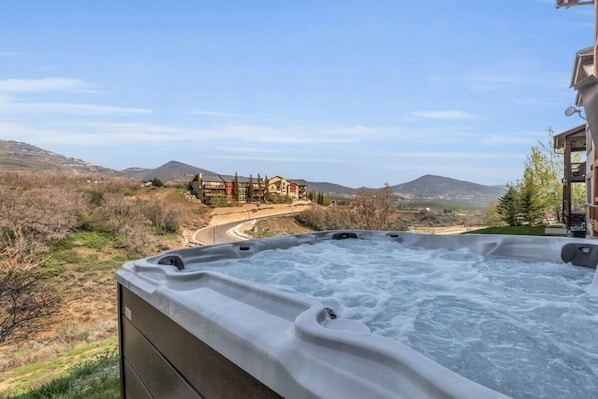 Loosen up amid the bubbles in a hot tub with panoramic mountain views.