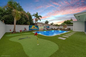 OMG! Swing into relaxation with an amazing pool and sunset view.