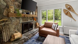 Open Living area with fireplace and tv for family fun time