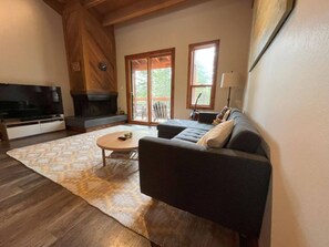 The living room has a Smart TV and balcony access. Great for entertaining and lounging after a long day of exploring!