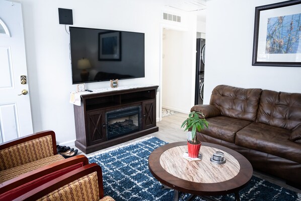 Living Room with fire place and wall mounted smart TV