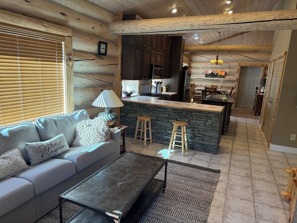 Living room, kitchen, & dining area in back.