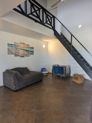 Spacious open concept living room with vaulted ceiling.