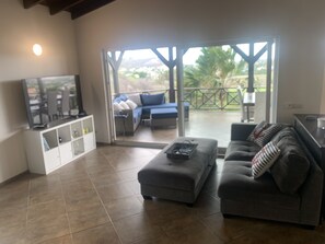 Spacious open concept living room with vaulted ceiling.