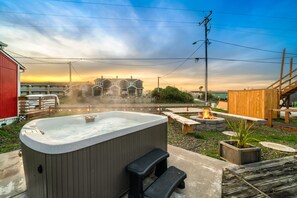 Soak in the brand new hot tub while listening to the ocean waves in front of you