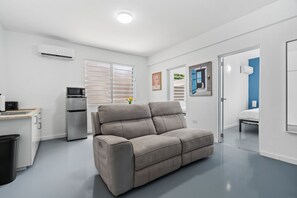 Feel at home in a space that combines comfort and style, featuring vibrant walls and cozy seating. 