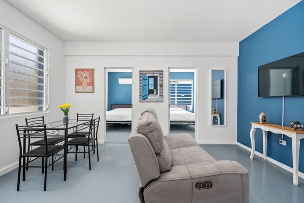 Find relaxation amidst the chic decor, comfortable seating, and ample natural light filtering through the windows.