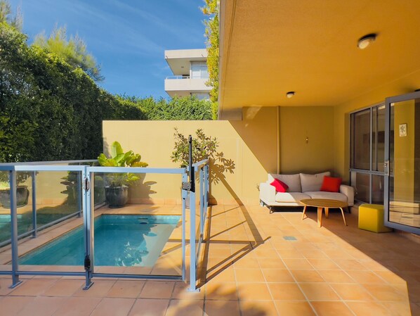 The Garden Apartment's Private Outdoor Courtyard and Pool