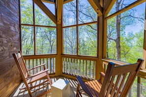 Rocking chairs on the screened-in porch for relaxing