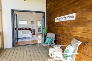 The apartment features a screened-in porch