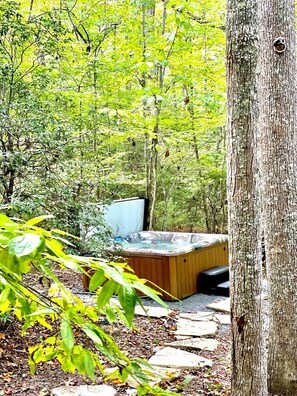 A secluded large hot tub makes you feel like you've snuck away to a hidden hot spring. 