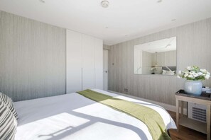 Bedroom 2 with king bed & A/C for personalized comfort and restful sleep