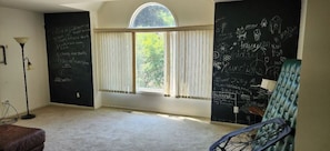 Family room coming from bedrooms. Fun chalkboard walls to have fun with.