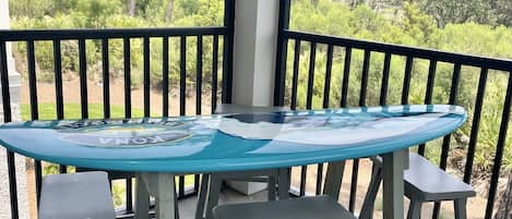 Surfboard table on screened porch