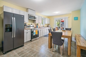 Open kitchen to dining.  Fully functional with all appliances