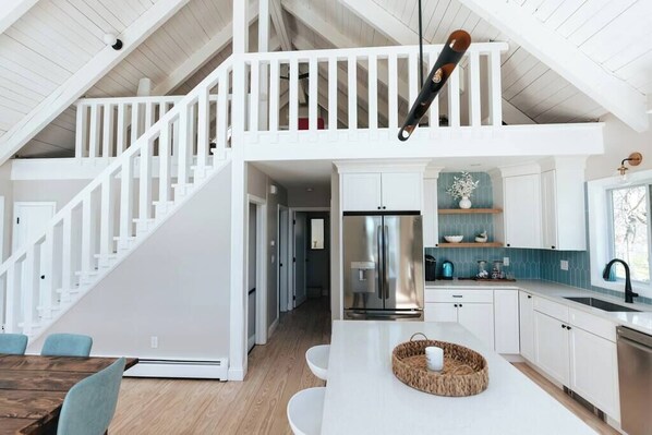 view of loft with large TV.