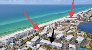 Lush property walking paths, close beach access, and access to Eastern lake.
